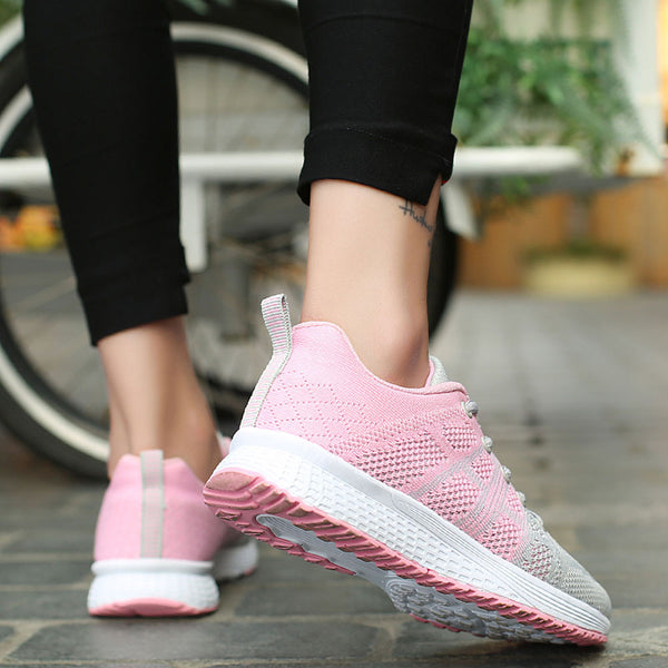 Women pink running sneakers